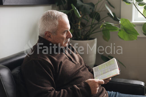 Senior Man Reading the Bible at Home