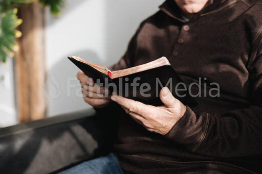 Senior Man Reading the Bible at Home