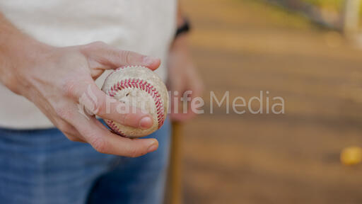 Man Holding a Baseball