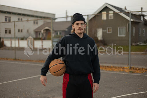 Man Holding a Basketball