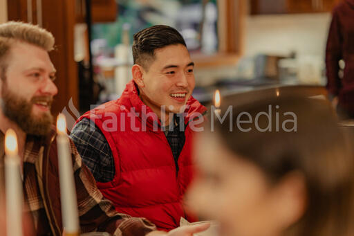 Friends Laughing and Enjoying a Meal Together