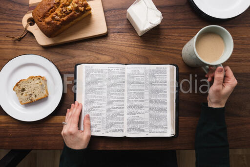 Woman Reading the Bible at the Breakfast Table