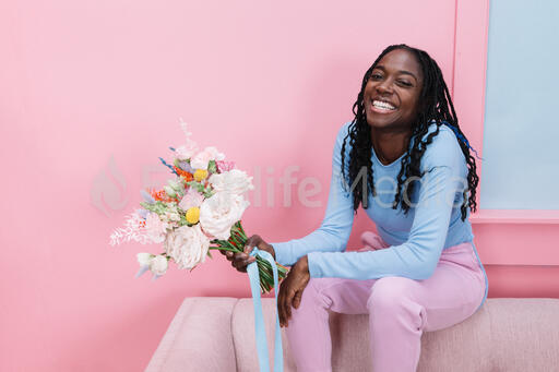 Woman Holding a Bouquet of Flowers